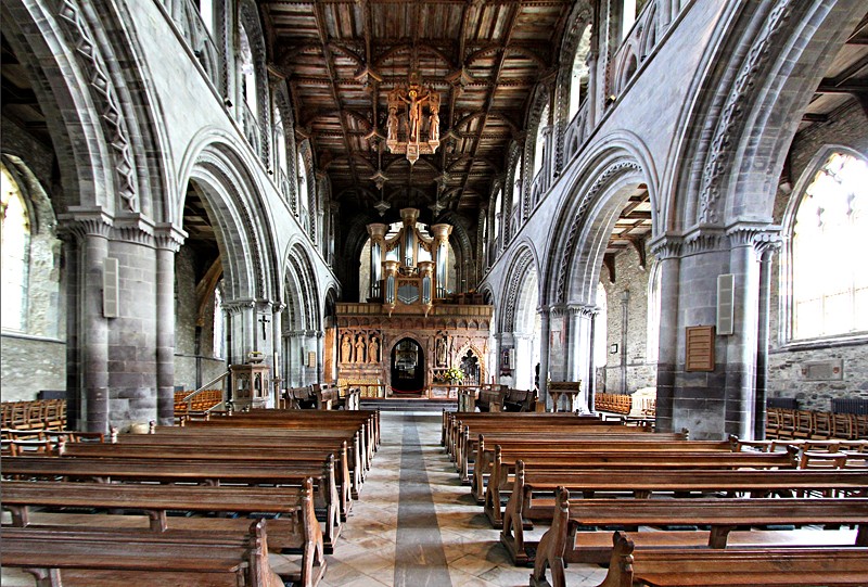 the sloping Nave clearly showing the outward leaning pillars